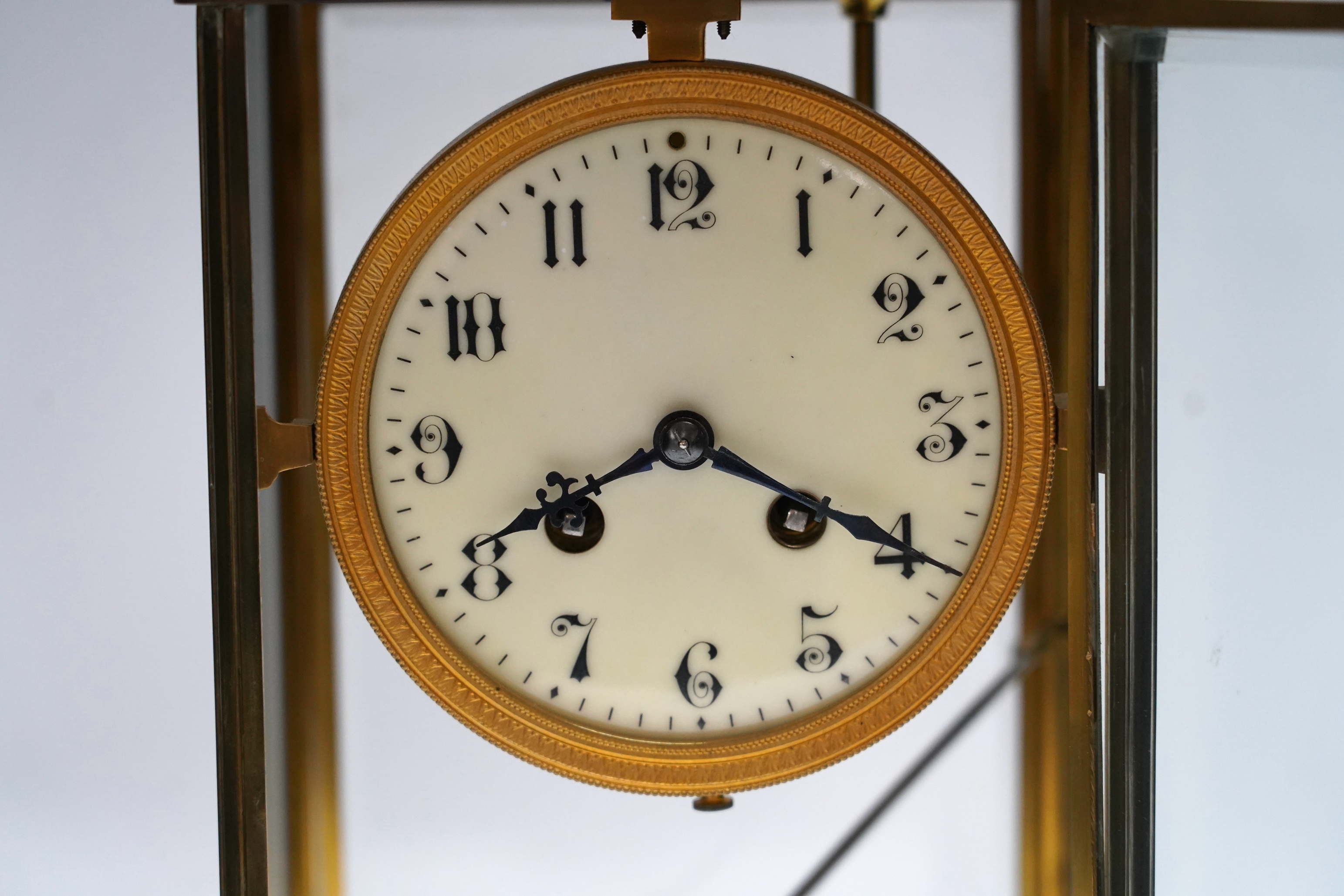 A French four glass mantel clock with mercury suspension and pendulum, 33cm